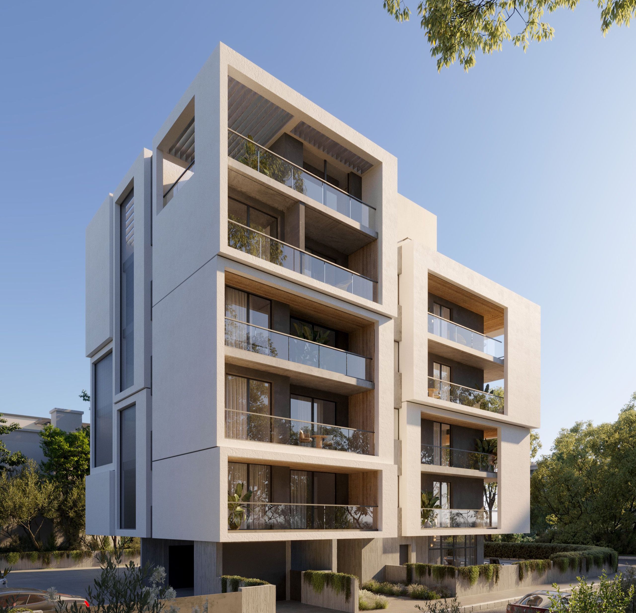 A modern, light-colored apartment building with glass balconies and contemporary geometric design.