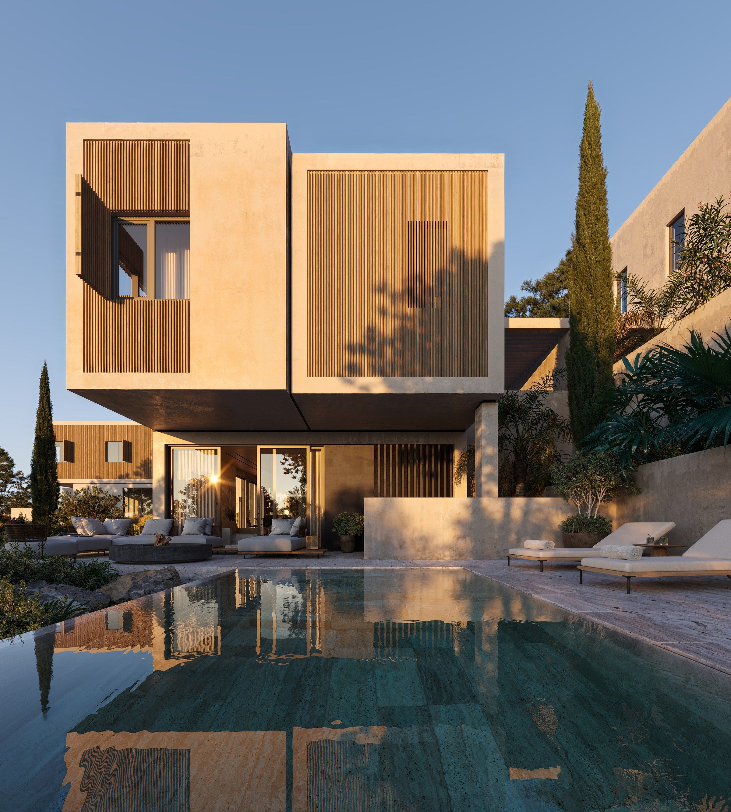Modern multi-level house with wooden shutters overlooks a serene pool reflecting blue sky.