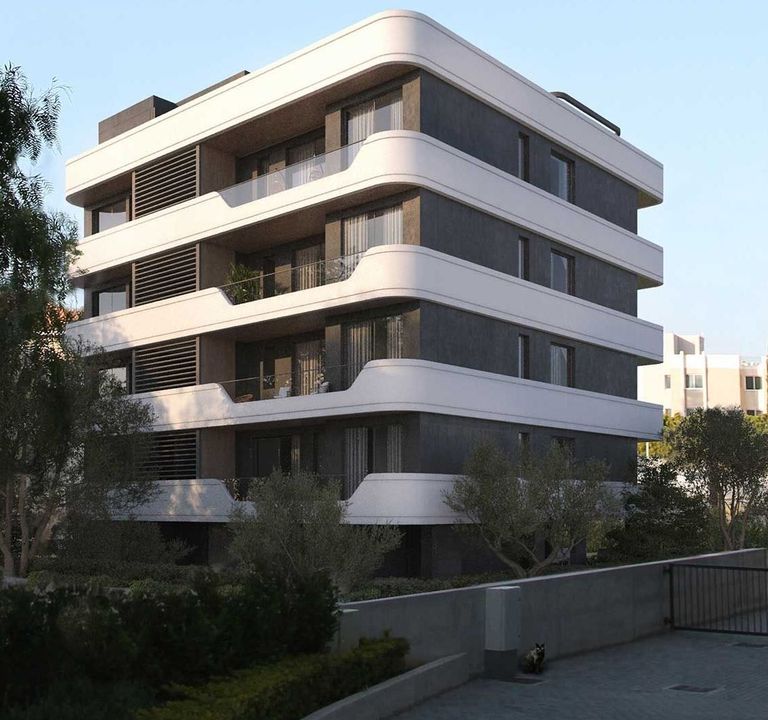 Modern residential building with distinctive curved white balconies and dark grey facade.