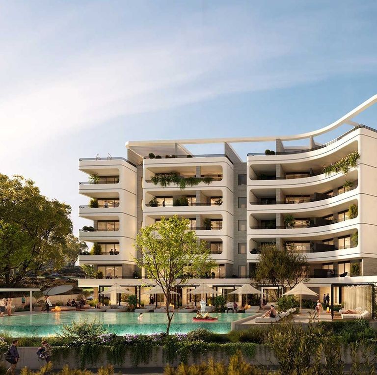 Luxury residential building with curved balconies overlooking a swimming pool and green landscaping.