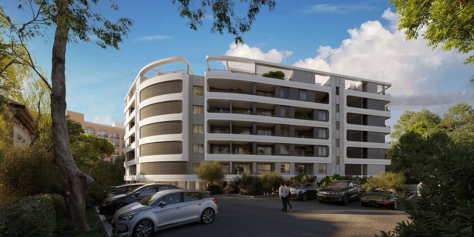 Modern white apartment building with curved balconies, green trees, and a busy parking lot.