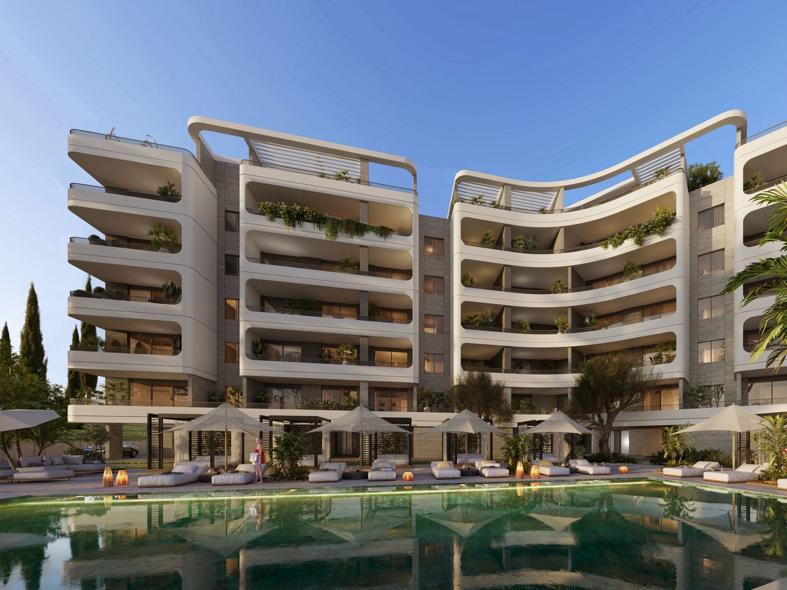 Luxurious modern apartment building with curved balconies overlooking a sparkling swimming pool.