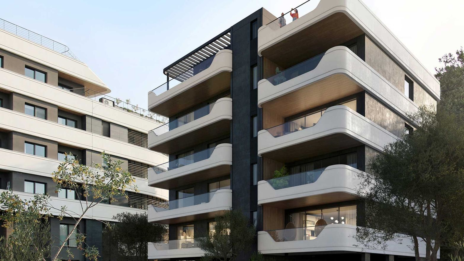 Modern apartment building featuring dark facade, many large windows, and uniquely curved white balconies.