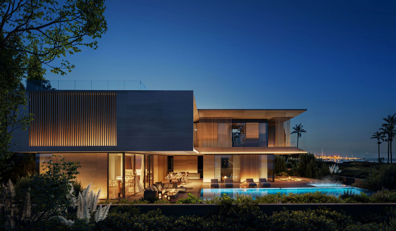 A modern luxury house with illuminated interior and a swimming pool at night.