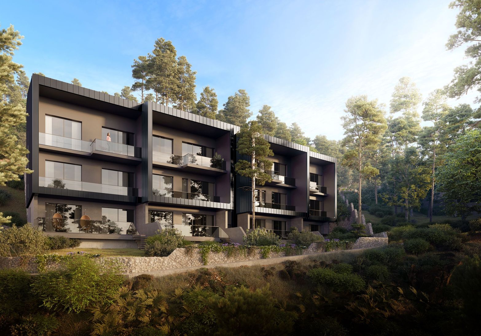 Modern dark facade buildings with glass balconies nestled in a lush green forest.