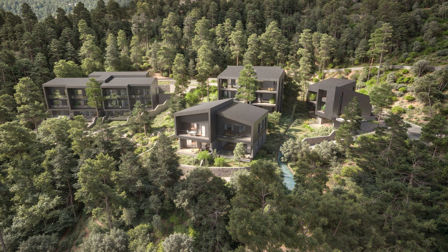 Modern dark-colored buildings are nestled within a dense green forest on a hillside.