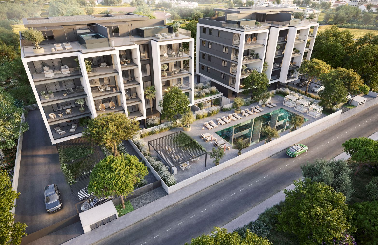 Aerial view of modern apartment buildings, a swimming pool, and lush green landscaping.